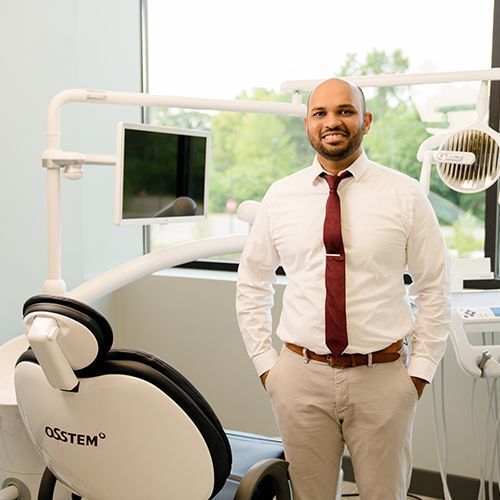 Dr. Rohan Shah caring for a patient at Washington Dental Studio